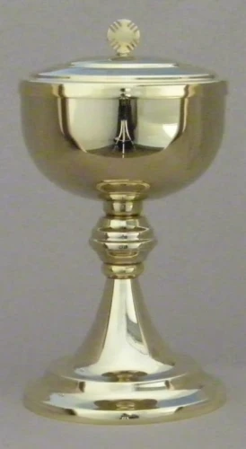 Ciboire en métal doré avec noeud. 